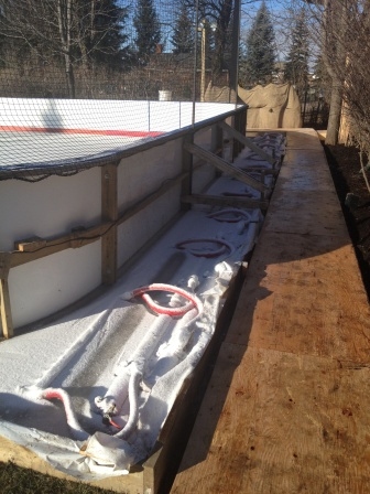 Portable ice rink with piping and headers