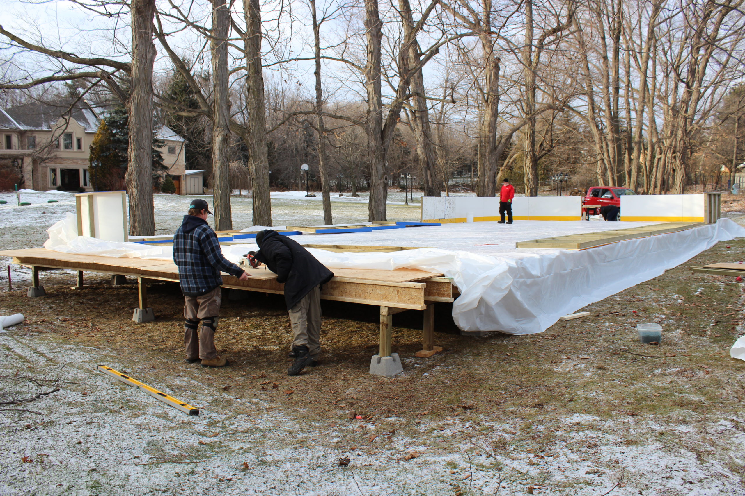 Portable ice rink with subfloor and dasher boards
