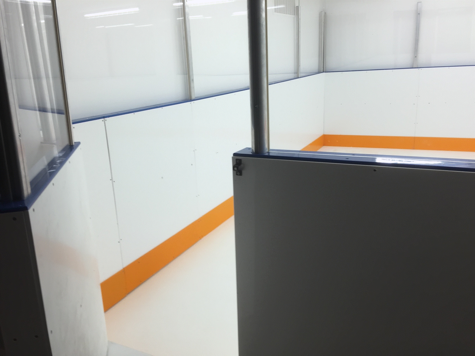 Basement rink with synthetic ice and plexi sheilding