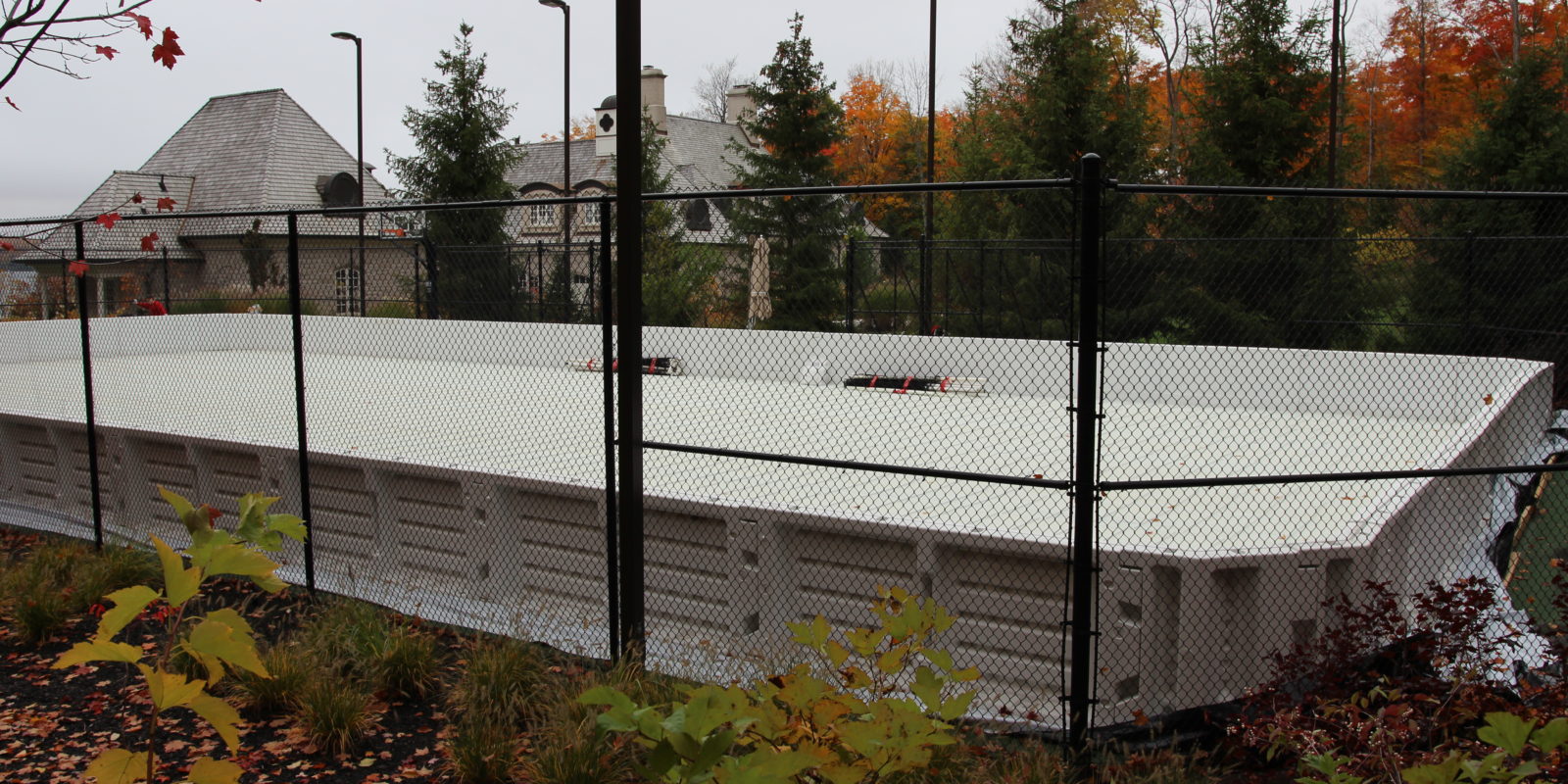 Portable refrigerated ice rink on tennis court