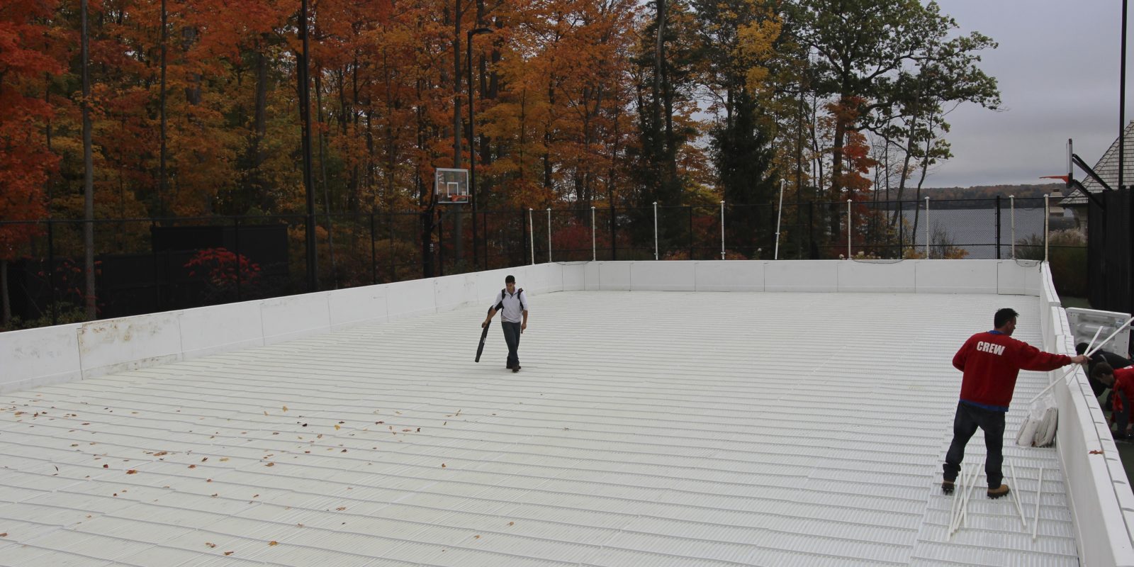 Portable refrigerated ice rink on tennis court